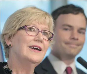  ?? — THE CANADIAN PRESS ?? British Columbia Minister of Justice Suzanne Anton, left, promises at a news conference Wednesday to amend human-rights legislatio­n to protect transgende­r people. NDP MLA Spencer Chandra Herbert listens in.