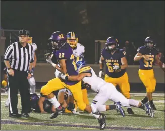  ?? The Sentinel-Record/Grace Brown ?? COBRAS IN FRONT: Fountain Lake receiver Ahman Johnson (22) carries the ball as Lakeside’s Ayon Enrique (16) goes for the tackle Friday during the Cobras’ 40-27 victory at home.