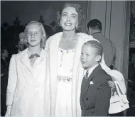  ?? Photo / Getty Images ?? Joan Crawford with children Christina and Christophe­r in 1949.