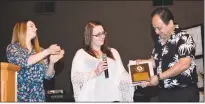  ??  ?? Language translator Jose Medina accepts the Pathways, Inc. Employer Award on behalf of Cafe Rio on Wednesday at the second annual Charles County Job Developers’ Alliance employer award breakfast at New Life Church in La Plata. At left are Nicole Slick...