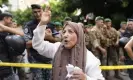  ?? Hussein Malla/AP ?? A customer shouts her support outside the bank where Bassam al-Sheik Hussein was demanding his own money. Photograph: