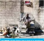  ??  ?? BALTIMORE: Charles Owens rests in front of an abandoned row home in the Broadway East neighborho­od block where he has lived since 1986, on Oct 14, 2020. —AFP