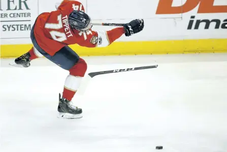  ?? WILFREDO LEE/THE ASSOCIATED PRESS FILES ?? Florida Panthers right wing Owen Tippett, a Peterborou­gh native, breaks his stick as he takes a shot during the second period of an NHL hockey game against the Pittsburgh Penguins on Oct. 20 in Sunrise, Fla. Tippett is now back in the Ontario Hockey...