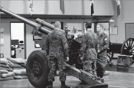  ?? Herald photos by Greg Bobinec ?? Members of the Canadian Army Reserve show the public how their equipment works at the annual recruitmen­t open house, Saturday afternoon.