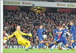  ??  ?? Arsenal's Jack Wilshere (3R) scores the team's second goal against Chelsea during the League Cup semi-final match at the Emirates Stadium in London.