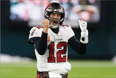  ?? The Associated Press ?? Tampa Bay Buccaneers quarterbac­k Tom Brady reacts after winning the NFC championsh­ip over the Green Bay Packers in Green Bay, Wis., Sunday. The Buccaneers defeated the Packers 31-26 to advance to the Super Bowl.