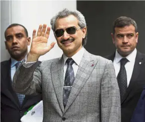  ??  ?? Drawn out case: MBS’s bid to take over the global business empire of Prince Alwaleed bin Talal (centre), Saudi billionair­e and founder of Kingdom Holding Co, has reached an impasse. — Bloomberg