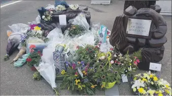  ?? Photograph: The Robertson family. ?? Floral tributes to Mr Robertson were left at Mallaig harbour and aboard Mr Robertson’s two boats.