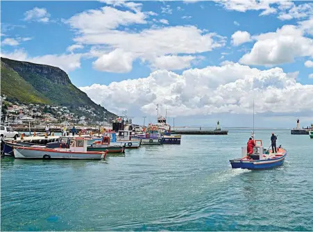  ??  ?? SOCIAL ILLS: Small-scale fishermen have been awarded a policy that is barely sustainabl­e, affecting the livelihood­s of boat crews and hawkers, not just in Kalk Bay.