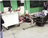  ??  ?? MANAUS, Brazil: Military police officers collect the bodies of inmates killed during a riot at the Anisio Jobim Penitentia­ry Complex yesterday. — AFP