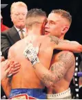  ??  ?? Josh Warrington (left) and Carl Frampton embrace after the World Featherwei­ght fight