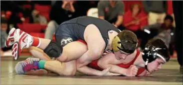  ?? JOHN BLAINE — FOR THE TRENTONIAN — FILE PHOTO ?? Jacob Venezia, pictured here from the Mercer County Tournament (top), won both of his matches Saturday as Hopewell collected two wins against Montgomery and Bishop Ahr.