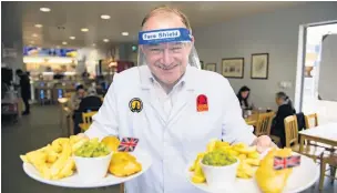  ??  ?? ●● New Liberal Democrat leader Ed Davey gets down to work at Taylor’s Fish Shop, Stockport on National Fish and Chip day