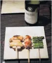  ?? PHOTO: REUTERS ?? Tasty treats . . . Japanese restaurant Torizen Seo offers yakitori grilled chicken on skewers with New Zealand wine in Tokyo.