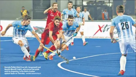  ?? ARABINDA MAHAPATRA/HT ?? Gonzalo Peillat (third from left, foreground) and Agustin Mazzilli (right), who scored two goals each for Argentina, in the thick of action against Spain on Thursday.