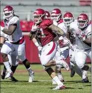  ?? NWA Democrat-Gazette/BEN GOFF ?? Arkansas running back Devwah Whaley impressed offensive coordinato­r Joe Craddock with a 45-yard run during the live-tackling period of Saturday’s scrimmage at Reynolds Razorback Stadium in Fayettevil­le.