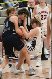  ?? Scott Herpst ?? Gordon Lee’s Addison Sturdivant and Macy Sharp try to wrestle the ball from a determined Brooke Matherly during their game at Heritage on Saturday night.