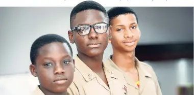  ?? RICARDO MAKYN/MULTIMEDIA PHOTO EDITOR ?? From left: Mailk Bogle, Damion Drackett and Nicholas Gayle, students of Wolmer’s Boys’ School, at the Ananda Alert National Missing Children’s Forum at the Jamaica Conference Centre on Thursday.