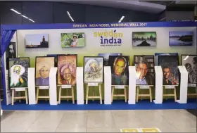  ??  ?? The ‘Sweden India Nobel Memorial Wall’ on display at the Rajiv Chowk Metro station.
