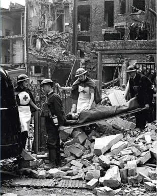  ??  ?? Human cost In what is likely a propaganda shot, a Londoner is rescued from a wrecked house in September 1940. Those who didn’t survive the raids were pieced together by volunteer nurses