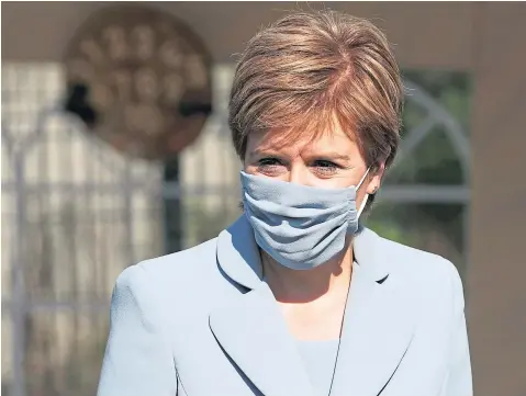  ??  ?? WARNING SHOT: First Minister Nicola Sturgeon has urged people to keep wearing masks and get vaccinated.