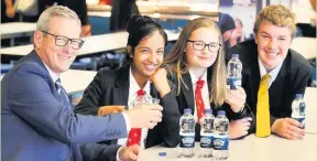  ??  ?? Rhyddings School headteache­r Paul Trickett with pupils Alisha Ali, Crystal Davis and Liam Godfrey