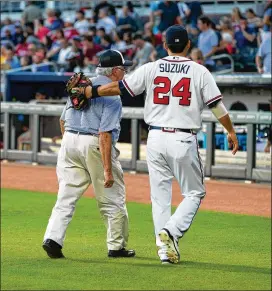  ?? KEVIN D. LILES / ATLANTA BRAVES ?? The late Justice Harris Hines was invited to throw out the ceremonial first pitch at a Braves game not long after he retired from the court.