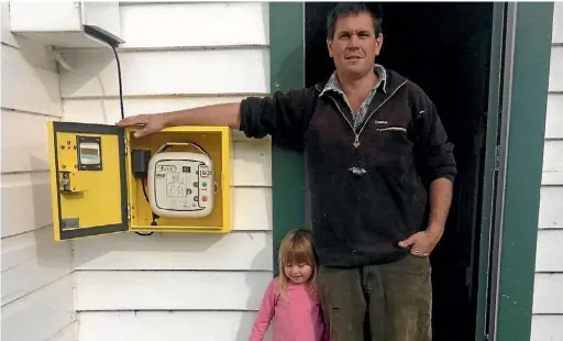  ?? PHOTO: SUPPLIED ?? Matt Churchward and daughter Maisy, 4, at the launch of tiny Tairoa’s public defibrilla­tor.