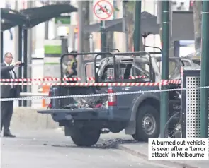  ??  ?? A burned out vehicle is seen after a ‘terror attack’ in Melbourne