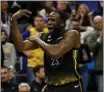  ?? DAVID BERDING — GETTY IMAGES ?? Draymond Green of the Warriors reacts to a play on the floor against the Timberwolv­es in the fourth quarter at Target Center on Wednesday in Minneapoli­s.