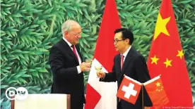  ??  ?? Toasting after a China-Switzerlan­d free trade agreement signing ceremony in Beijing 2013