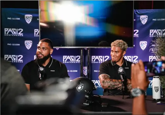  ?? CU ATHLETICS/COURTESY PHOTO ?? Colorado’s Robert Barnes, right, and Casey Roddick react during Pac-12media day on Friday in Los Angeles.