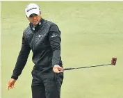  ??  ?? Finding his range: Jason Day on the 15th hole, where the tee was moved forward by 20 yards due to conditions