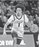  ?? AMBER SEARLS/USA TODAY SPORTS ?? Virginia Commonweal­th guard Jason Nelson (1) controls the ball against Dayton on Friday in Richmond, Va.