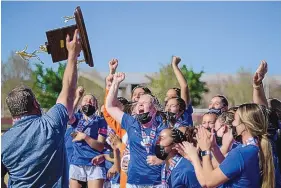  ?? ROBERTO E. ROSALES/JOURNAL ?? Carlsbad players cheer as they receive the girls Class 5A state title trophy after their 1-0 victory over Albuquerqu­e High. It is Carlsbad’s first girls state title.