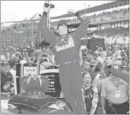  ?? SULLIVAN GETTY IMAGES/MATT ?? Kyle Busch celebrates his win at Indianapol­is last year, which acted like a springboar­d to the 2015 NASCAR championsh­ip.