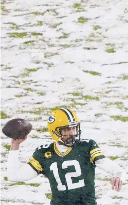  ?? MORRY GASH/AP ?? Packers’ Aaron Rodgers throws during the first half of a game against the Titans on Dec. 27 in Green Bay, Wis.