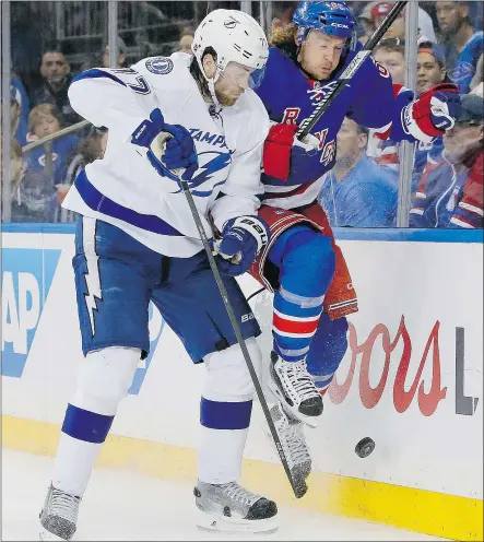  ?? — THE ASSOCIATED PRESS FILES ?? Tampa Bay Lightning defenceman Victor Hedman collides with New York Rangers winger Carl Hagelin during Game 1 of the Eastern Conference final on Saturday in New York.