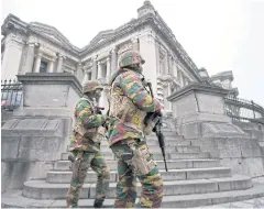  ?? AP ?? Belgian soldiers patrol around the court building where Salah Abdeslam, top suspect in last year’s deadly Paris attacks, was about to appear in Brussels on Thursday.