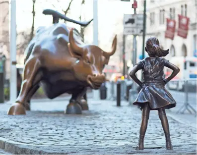  ?? MARK LENNIHAN, AP ?? Fearless Girl staked her claim in front of Charging Bull on the eve of Internatio­nal Women’s Day last month.