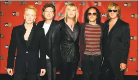  ??  ?? Def Leppard, from left, guitarist Phil Collen, drummer Rick Allen, bassist Rick Savage, guitarist Vivian Campbell and singer Joe Elliott