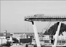  ??  ?? The collapsed Morandi Bridge is seen in the Italian port city of Genoa, Italy August 15, 2018. (Photo: Reuters)