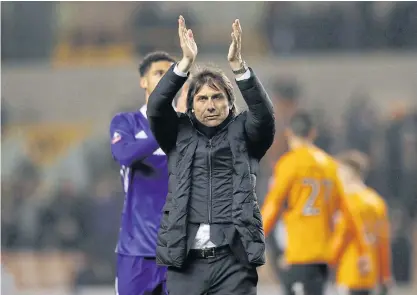  ??  ?? Chelsea manager Antonio Conte applauds fans after a recent match.