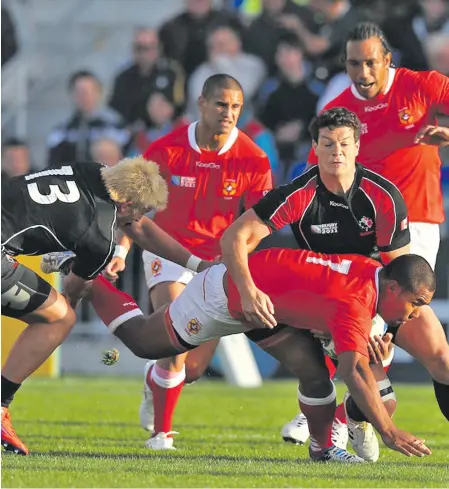  ?? Photo: Zimbio ?? DTH Van Der Merwe and Ciaran Hearn of Canada tackle Sione Vaiomounga (7) of Tonga during the 2011 Rugby World Cup Pool A clash at Northland Events Centre in Whangarei, New Zealand.