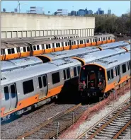  ?? NANCY LANE / BOSTON HERALD FILE ?? New MBTA Orange Line trains sit on the tracks at Wellington Station on April 26.