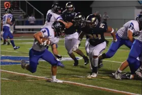  ?? AUSTIN HERTZOG - MEDIANEWS GROUP ?? Spring-Ford’s James Albert (24) pursues CB South rusher Joe McSweeney during the second half Aug. 23.