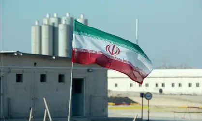  ?? ?? An Iranian flag flies at the Bushehr nuclear power plant in Iran. Photograph: Atta Kenare/AFP/Getty Images