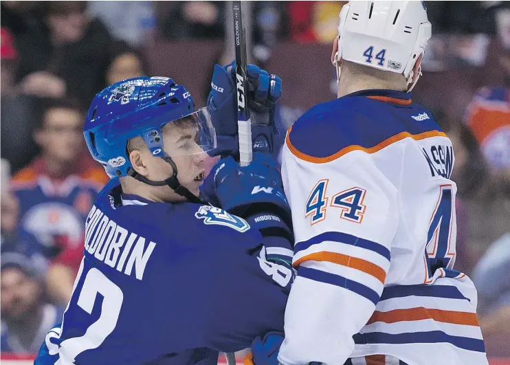  ?? GERRY KAHRMANN/PNG FILES ?? The Vancouver Canucks Nikolay Goldobin, left, runs into Edmonton’s Zack Kassian in a game this season. The winger has been asked to bring more grit.