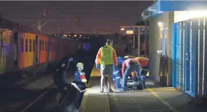  ?? Picture: Neil McCartney ?? CASUALTY. Emergency personnel assist one of the injured at the Van Riebeeck station in Kempton Park on Thursday. There are no reported fatalities, but scores of people were injured.