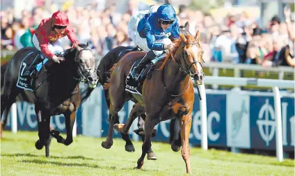  ??  ?? TOO GOOD. Masar, ridden by William Buick, races clear of the opposition to win Saturday’s Investec Derby at Epsom.